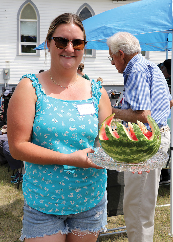 Flora Regular holding hand crafted watermelon. <br />
